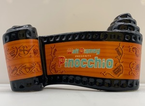 lot 79 image: WALT DISNEY - Enesco Classic Collection Little Statues - Opening Title Pinocchio Film Roll Figurine