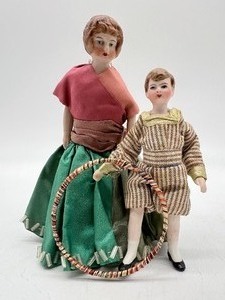 lot 214 image: Antique Vintage Dollhouse Doll Miniatures - Mom and Boy with Toy Hoop Ring