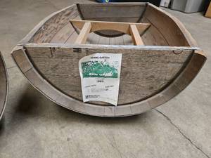 lot 5 image: 2 whiskey barrel garden planters (baselegs are attached inside planter for easier transportation)