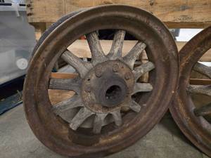 lot 9 image: Pair of small vintage 17 12 metal wheels with wooden spokes