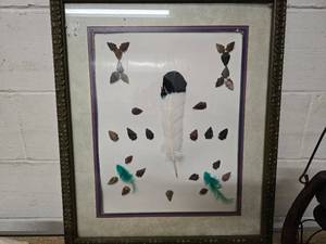 lot 10 image: Framed arrow head and feather artwork (modern arrow heads), vintage lantern, and skull
