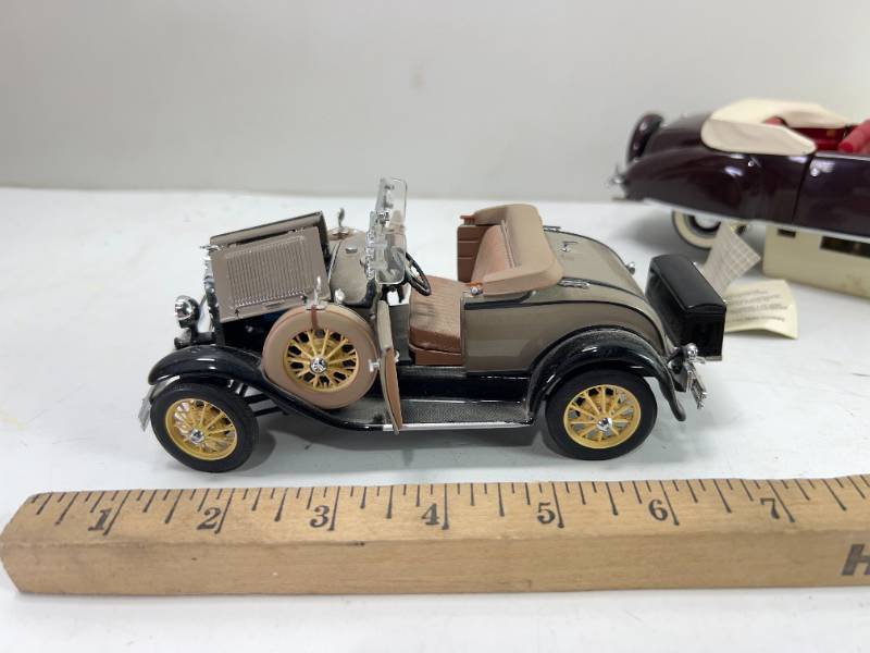 lot 1076 image: 1931 FORD MODEL A and 1941 LINCOLN CONTINENTAL DECANTERS