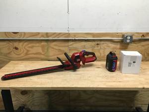 lot 142 image: Toro 60V MAX 24 in Hedge Trimmer with 2.5Ah Battery And Charger Model # 51840