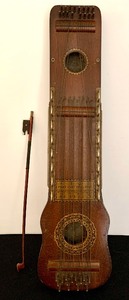 lot 10 image: Vintage Ukelin with Sheet Music