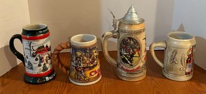 lot 196 image: Four Vintage Budweiser Steins