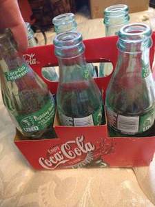 lot 220 image: Six Glass Sioux Coke Bottles 2000
