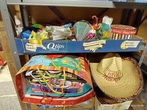 lot 273 image: Two Shelves Party Supplies & Mexican Hat