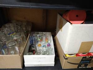 lot 278 image: Shelf of Kozies, Shot Glasses & Pint Glasses