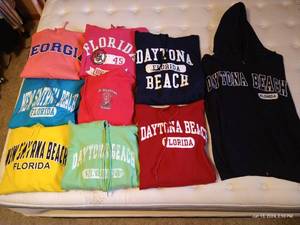 lot 585 image: (9) Florida & Georgia Hoodies