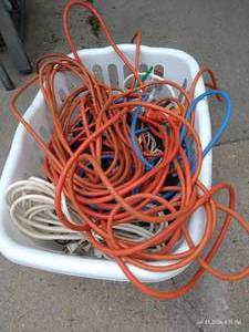 lot 672 image: Laundry Basket Full of Extension Cords