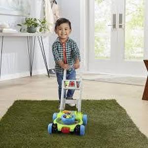 lot 92 image: VTech Pop and Spin Mower - English Edition
