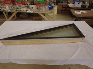 lot 99 image: Custom Triangular Window with Simpson Crosslake Lumber Frame