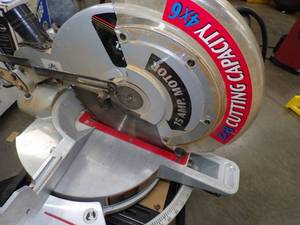 lot 15 image: Delta Miter Saw with Stand