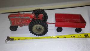 lot 708 image: Cast Tractor and ERTL Wagon.