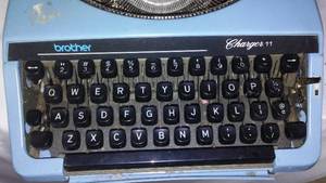 lot 787 image: Compact Portable Typewriter, Brother, Charger II.