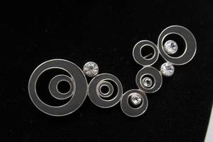 lot 34 image: Larger Signed Sterling Silver Modernist Jeweled Circles Brooch