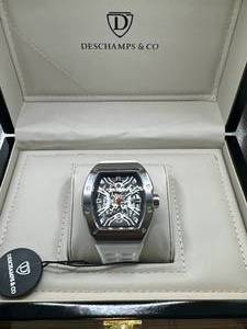 lot 11 image: Brand New Deschamps & Co. Skeleton Glass Exhibition Back Watch $1177.00 Retail