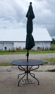 Black Wrought Iron Patio Table with Iron Umbrella Stand and Umbrella