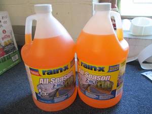 lot 104 image: All Season Rain - X, 2 Bottles...