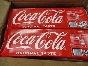 lot 140 image: Coco Cola 24 cans...