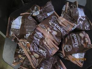 lot 27 image: 22 bags of milk chocolate coconut almonds 11102024