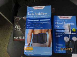 lot 44 image: back stabalizer, knee sleeve and blood preassure kit