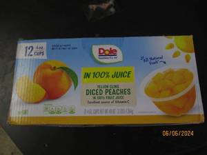 lot 91 image: package of 124oz cups of dole yellow cling diced peaches in 100 percent fruit juice best buy date of may 2024