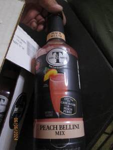 lot 94 image: case of 61qt mr&ampmrs T peach bellinin mix best buy date of may 2024