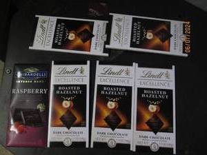 lot 186 image: 6 candy bars 1 ghirardelli and 5 lindt best buy date of 122024 and 32024