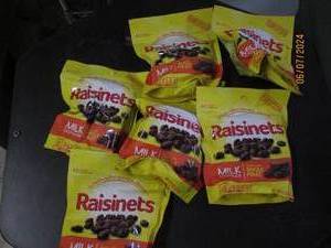 lot 211 image: 68 oz bags of raisinets best buy date of 72024