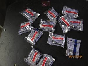 lot 221 image: 121.4 oz bars of chunky best buy date of 62024