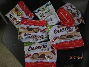 lot 254 image: 5 bags of kinder bueno chocolate bites and 1 bag of cocmels Best By 01112024,042024