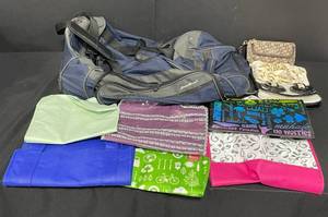 lot 86 image: Eddie Bauer Duffle Bag on Wheels, 3 ClutchesWallets, 1 Hanging Jewelry Organizer and Various Reusable Bags