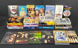 lot 103 image: Variety of DVDs and VHS Tapes inc The Notebook, Forest Gump, Happy Gilmore, Anywhere But Here, Twilight, The Mummy and More