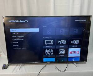 lot 117 image: 60 Hitachi LCD Roku TV w Remote & Instructions - powers up