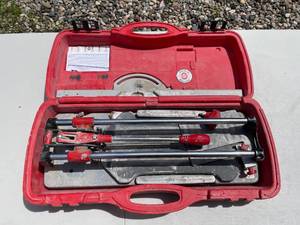 lot 24 image: RUBI Tile Cutter with Red Carrying Case