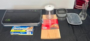 lot 106 image: Food Saver (untested), Grilling Planks, Bud Vase, Plastic Storage Containers