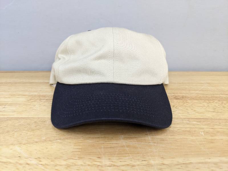lot 122A image: 12 Brand New Advantage Series LTD Stone and Navy Hats OSFM  A