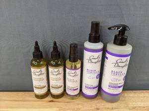 lot 29F image: New Carols Daughter (2) Goddess Strength Castor Hair Oil, Black Vanilla Leave In Conditioner Spray, Black Vanilla Moisture & Shine System, Luscious Moisture Shampoo, Shine Enhancing Hair Sheen, Package Retail $67.11 I