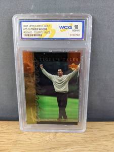 lot 31G image: Tiger Woods 2001 Upper Deck Golf WCG Graded 10 Rookie Tigers Tales Card #TT19 V