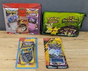 lot 67E image: Brand New Pokemon Trading Card Game Packs Revavroom, Arma Rouge, and Hounstone Booster Pack, 2023 Trick or Trade BOOster Bundle, and More Blister Packs I
