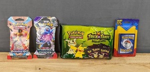 lot 27E image: Brand New Pokemon Trading Card Game Packs Scarlet and Violet Paradox Rift and Temporal Forces Booster, 2023 Trick or Trade BOOster Bundle, and Trading Card 20 Plus Promo Blister I
