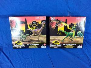 lot 128 image: 2 New Jurassic Park Dr. Ian Malcolm Tactical Claw Pack