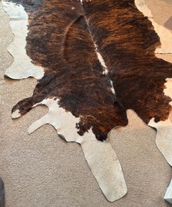 lot 7 image: Large Cow Hide Area Rug