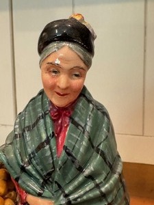 lot 42 image: Vintage Royal Doulton The Orange Lady Figurine