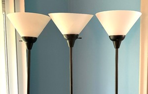 lot 55A image: Three Sleek Black Floor Lamps