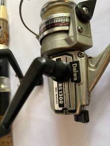 lot 231 image: Two Fishing Rod and Reels Includes Daiwa RS1300 and Eagle Claw 7520 with a Landing Net