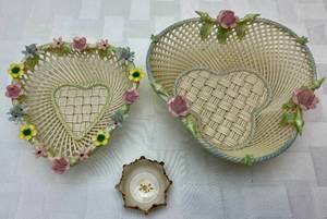 lot 48 image: Belleek Irish Shamrock Roses Four Strand Basket, Belleek Four Strand Basket Weave Heart Shaped Basket and Belleek Willets Salt Dip