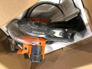 lot 38 image: RIDGID 15 Amp 10 in. Corded Dual Bevel Miter Saw with LED Cut Line Indicator Customer  Returns See Pictures