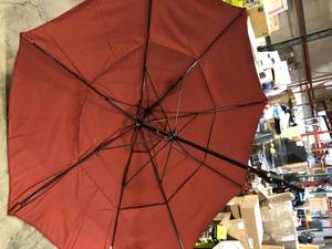 lot 47 image: California Umbrella 11 ft. Bronze Aluminum Pole Market Fiberglass Ribs Collar Tilt Crank Lift Outdoor Patio Umbrella in Henna Sunbrella Customer  Returns See Pictures